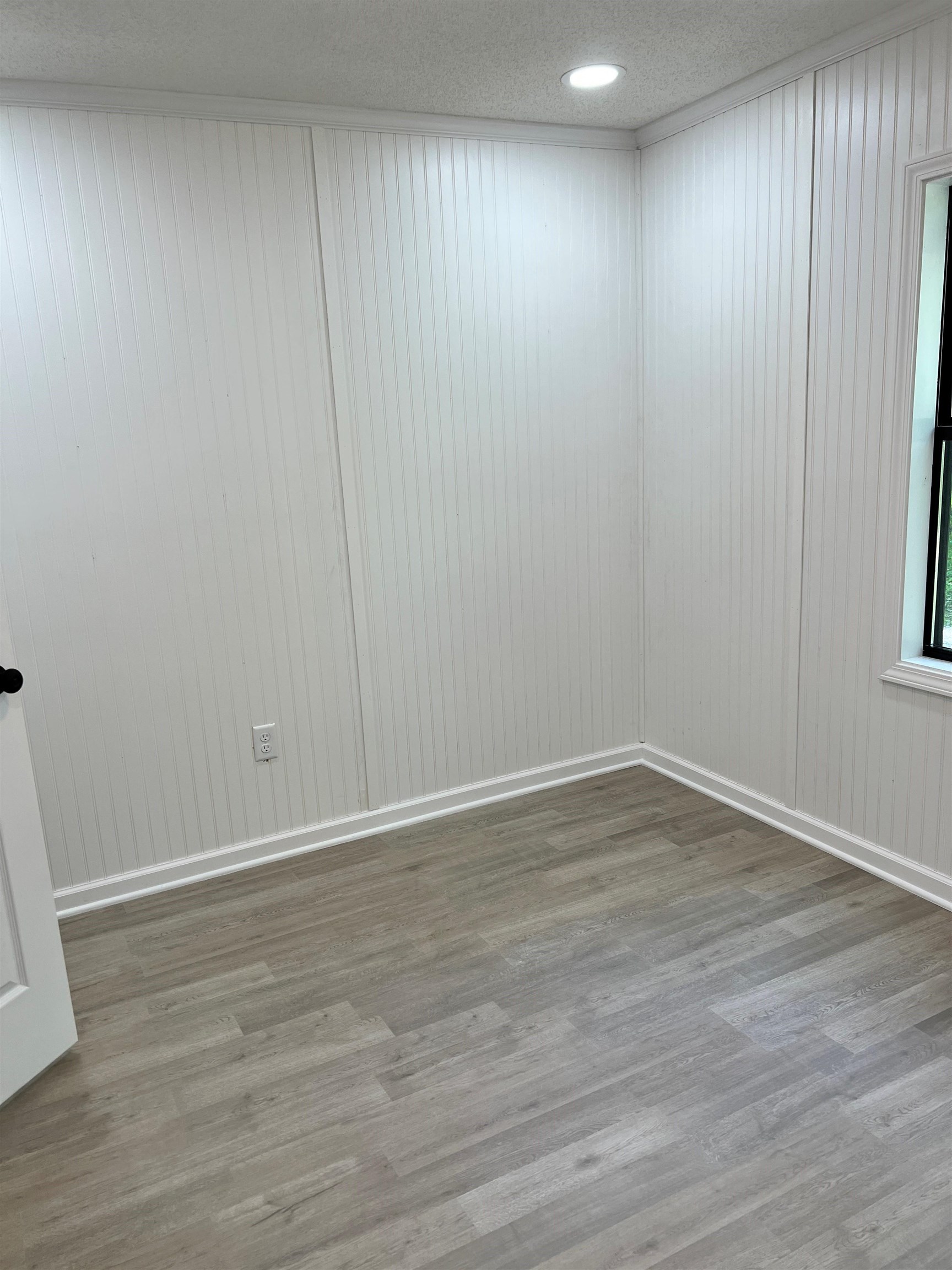 549 South Rowlett Street Collierville, TN 38017 - Photo 25 of 27 a view of an empty room with wooden floor