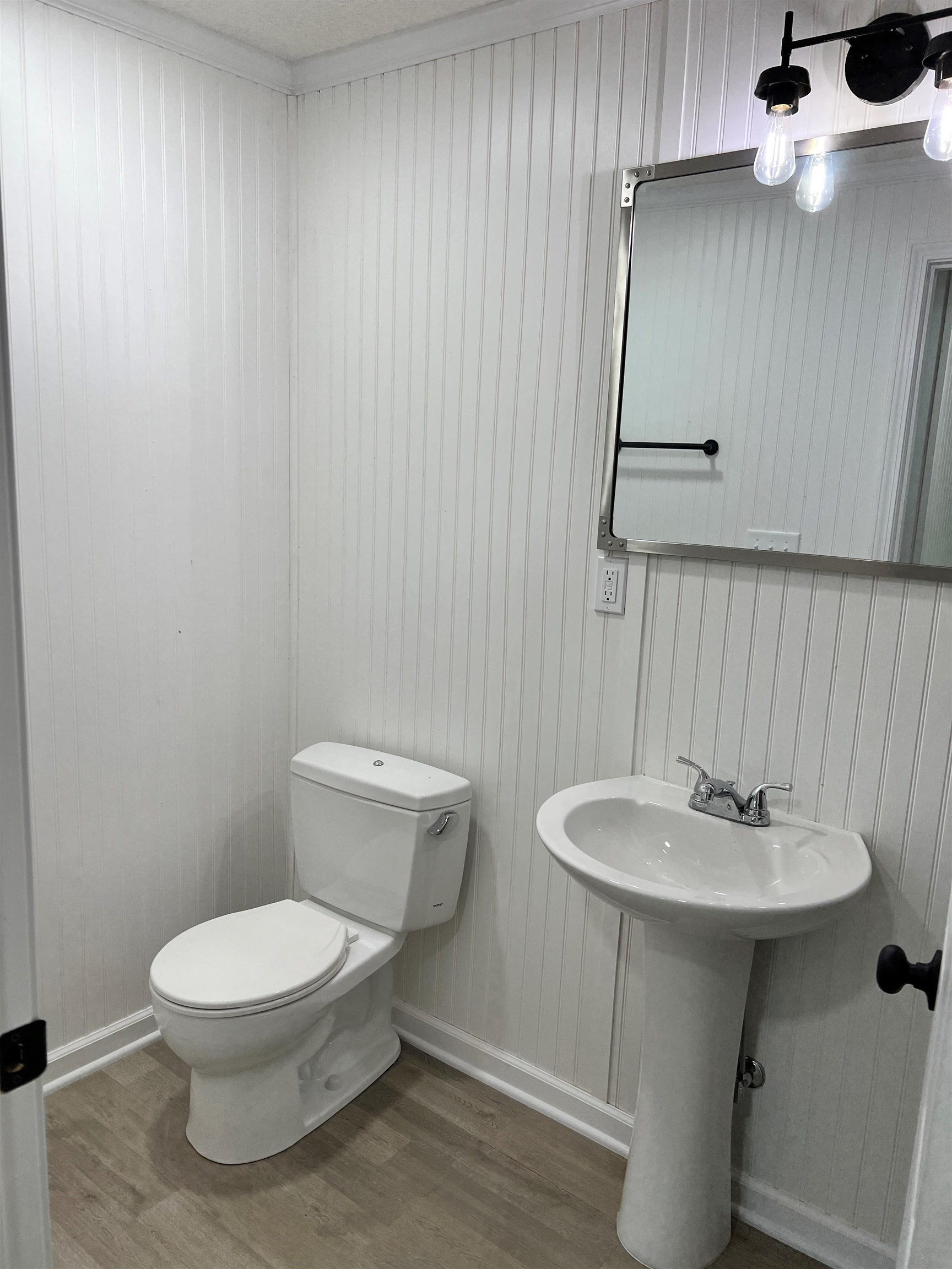 549 South Rowlett Street Collierville, TN 38017 - Photo 26 of 27 a bathroom with a sink a toilet and mirror