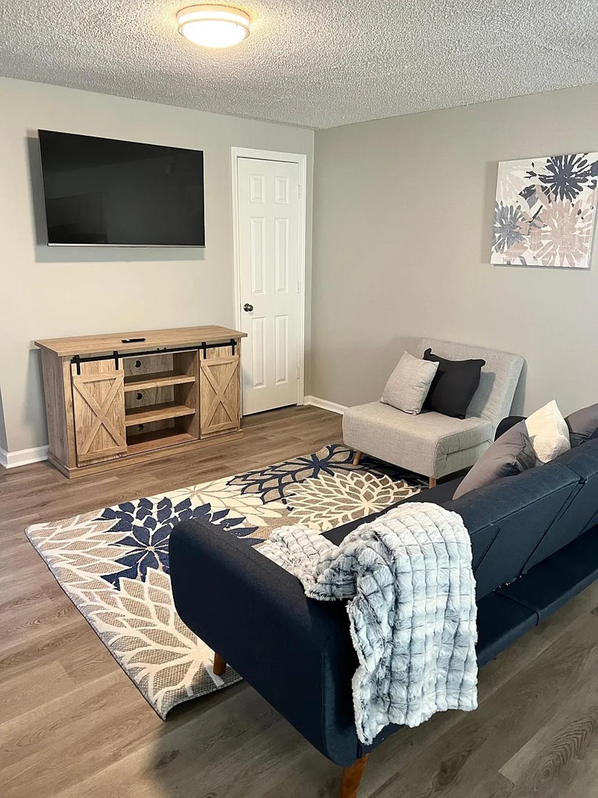 549 South Rowlett Street Collierville, TN 38017 - Photo 3 of 27 a living room with furniture and a flat screen tv