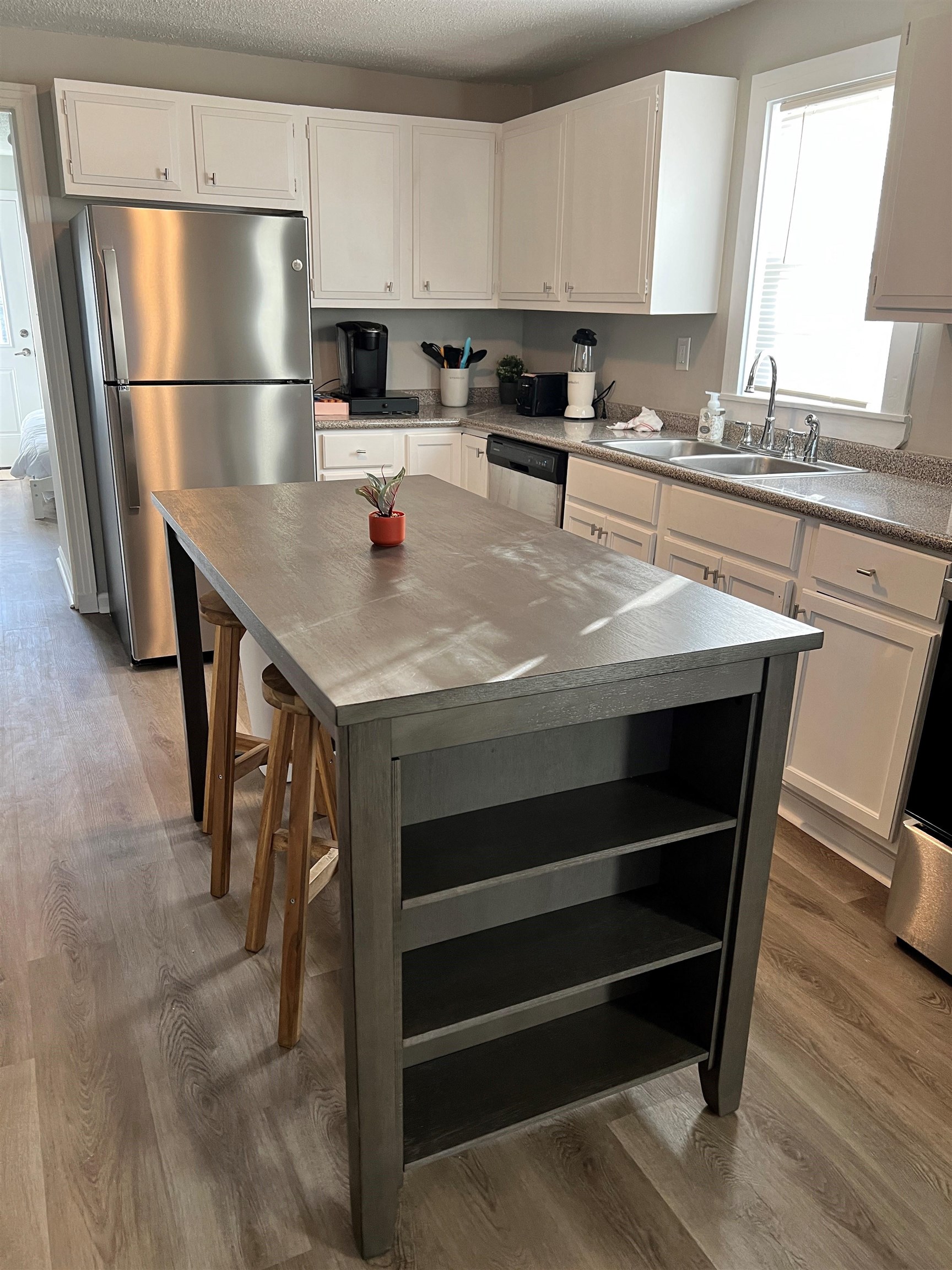 549 South Rowlett Street Collierville, TN 38017 - Photo 4 of 27 a kitchen with a stove a refrigerator and a sink