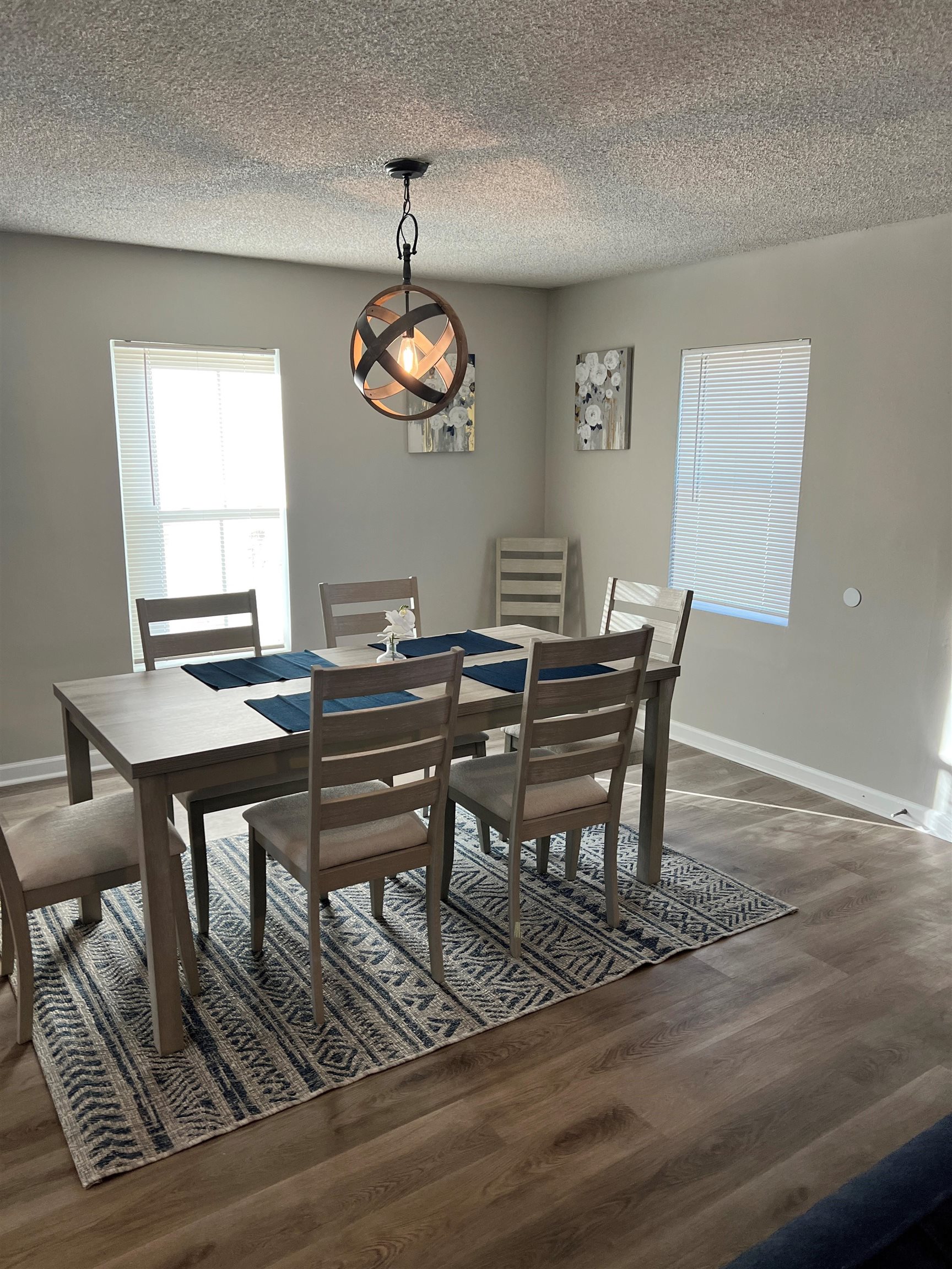 549 South Rowlett Street Collierville, TN 38017 - Photo 6 of 27 a view of a dining room with furniture wooden floor and chandelier