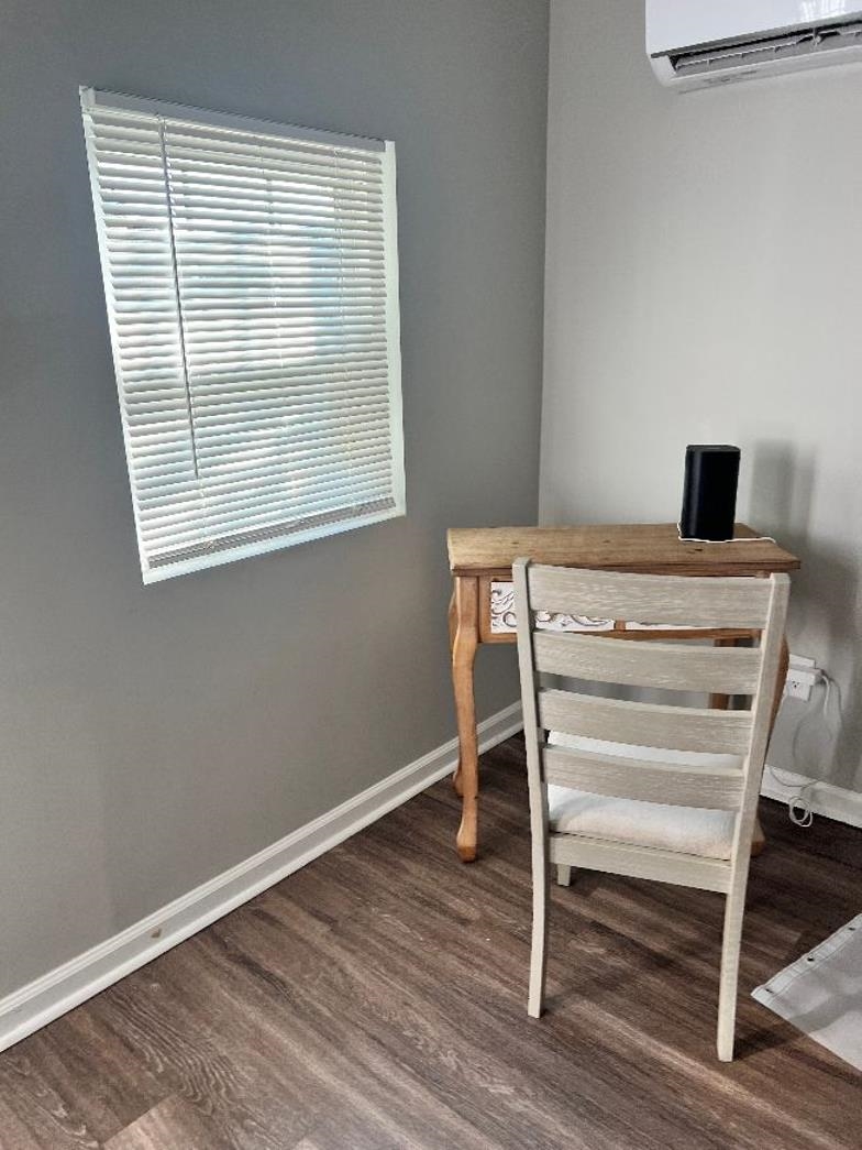 549 South Rowlett Street Collierville, TN 38017 - Photo 7 of 27 a view of a workspace with wooden floor and a window