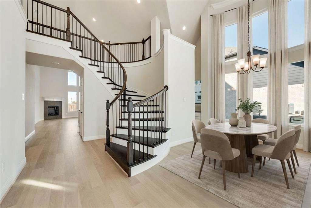 a view of entryway dining room and hall with wooden floor