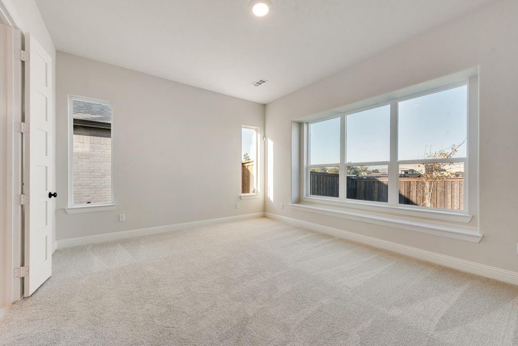 1329 Sundance Lane Justin, TX 76247 - Photo 18 of 37 a view of an empty room with a window