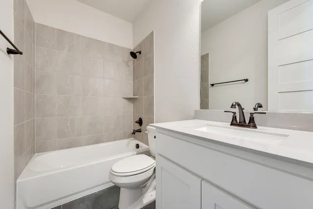 a bathroom with a sink a toilet and a bathtub