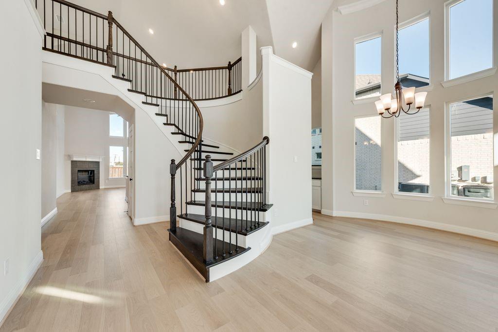 1329 Sundance Lane Justin, TX 76247 - Photo 2 of 37 a view of entryway and hall with wooden floor