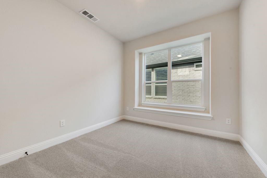 1329 Sundance Lane Justin, TX 76247 - Photo 23 of 37 an empty room with a window