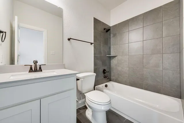 a bathroom with a sink a toilet and a bathtub