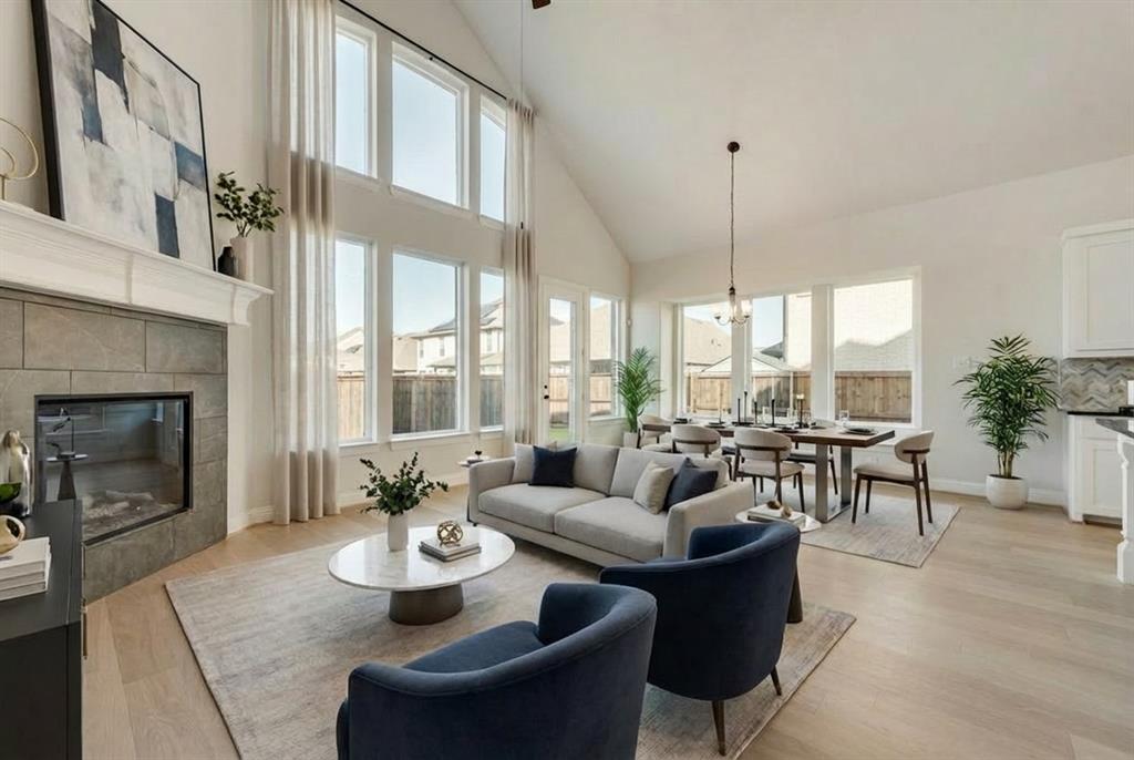 1329 Sundance Lane Justin, TX 76247 - Photo 8 of 37 a living room with furniture fireplace and a large window