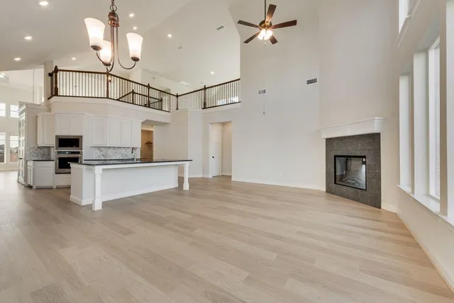 a view of a kitchen with furniture and a ceiling fan