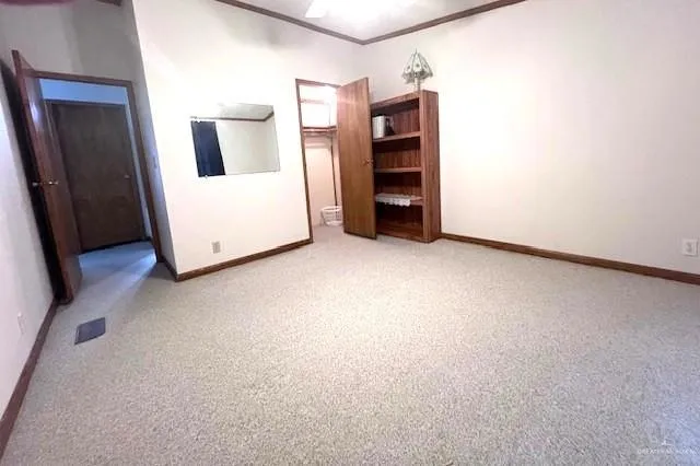 a view of a room with a hallway