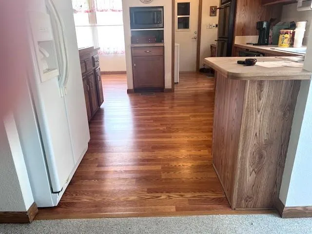 a view of dinning room and wooden floor