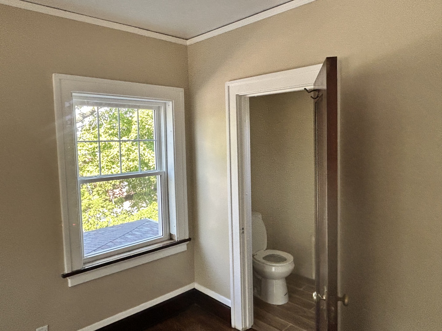 200 East Dakota Street Spring Valley, IL 61362 - Photo 19 of 23 a bathroom with a granite countertop toilet a sink a window and a shower