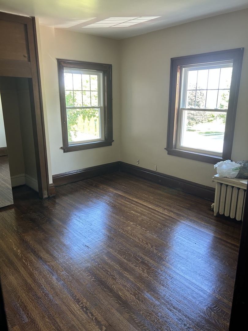 200 East Dakota Street Spring Valley, IL 61362 - Photo 22 of 23 an empty room with wooden floor and windows