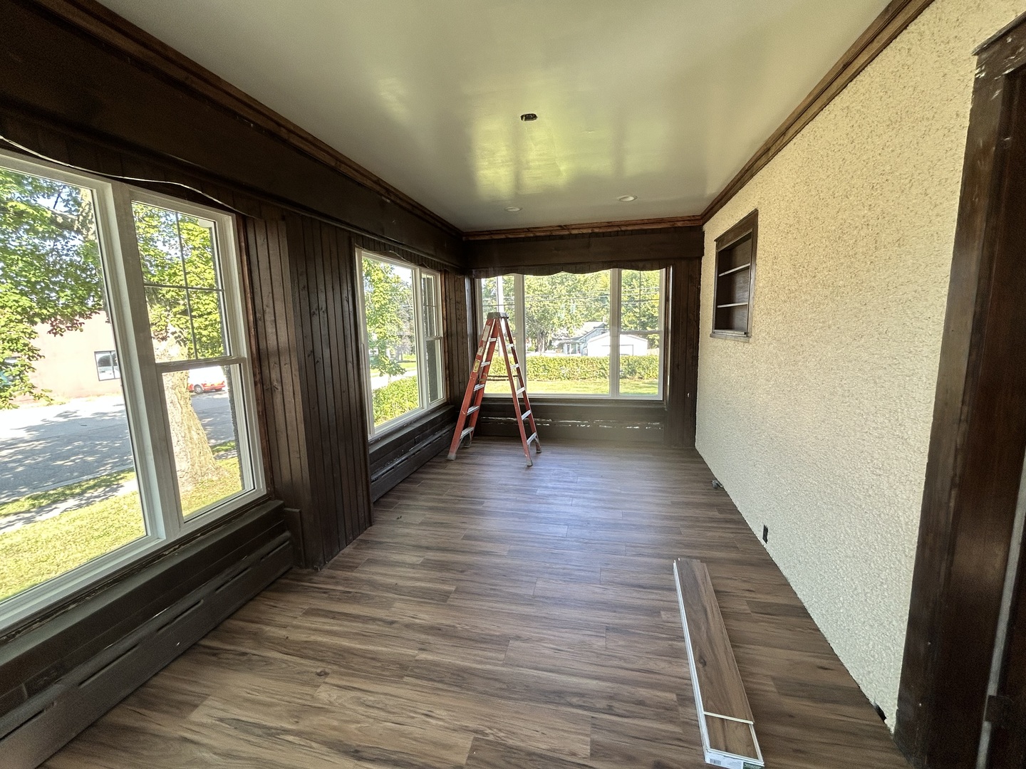 200 East Dakota Street Spring Valley, IL 61362 - Photo 9 of 23 a view of an empty room with wooden floor and a window