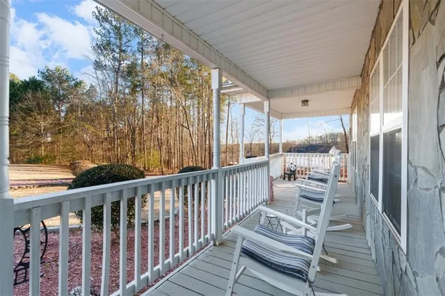 a view of a balcony with chairs