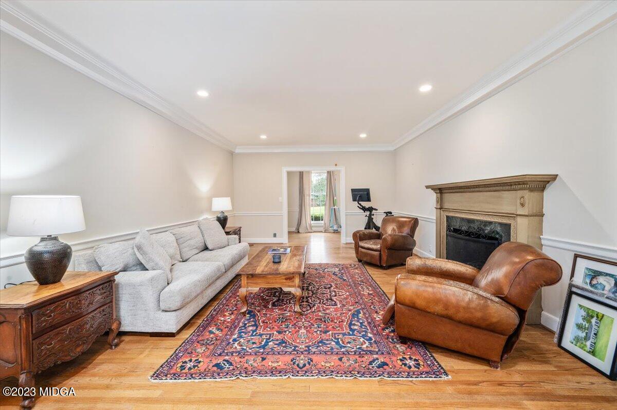 4163 Canyon Road Macon, GA 31210 - Photo 12 of 20 a living room with furniture a rug and a fireplace