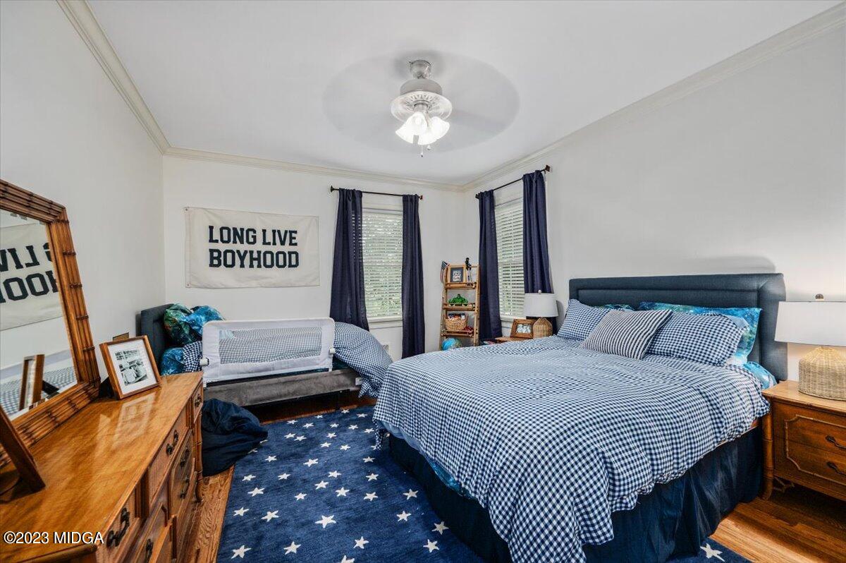 4163 Canyon Road Macon, GA 31210 - Photo 14 of 20 a bedroom with bed and wooden floor