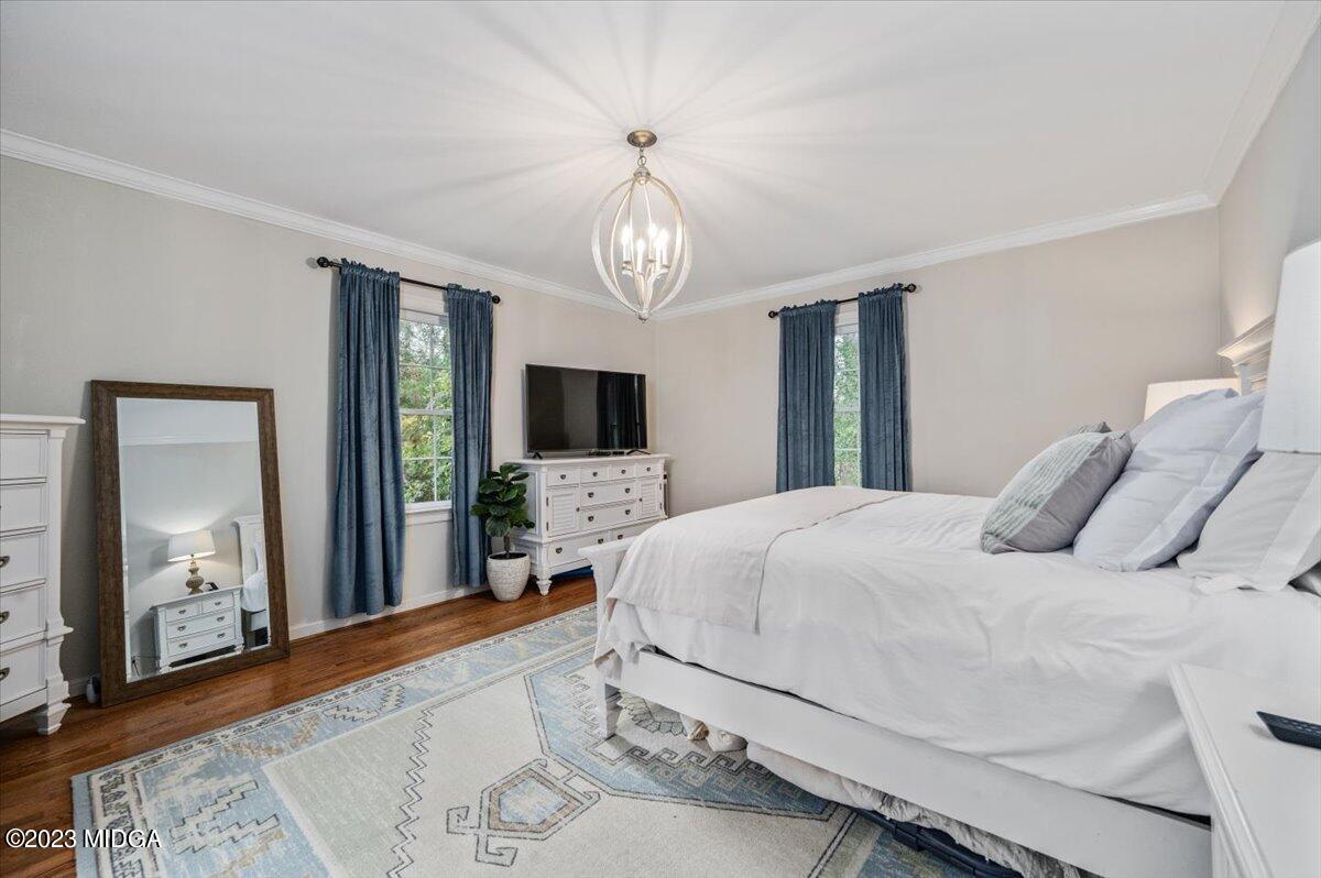 4163 Canyon Road Macon, GA 31210 - Photo 17 of 20 a bedroom with a bed and a flat screen tv