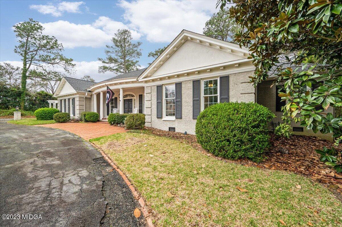 4163 Canyon Road Macon, GA 31210 - Photo 19 of 20 a view of a house with a garden and pathway