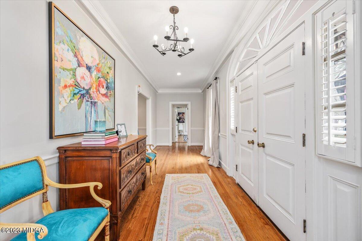 4163 Canyon Road Macon, GA 31210 - Photo 3 of 20 a view of a hallway with furniture and chandelier