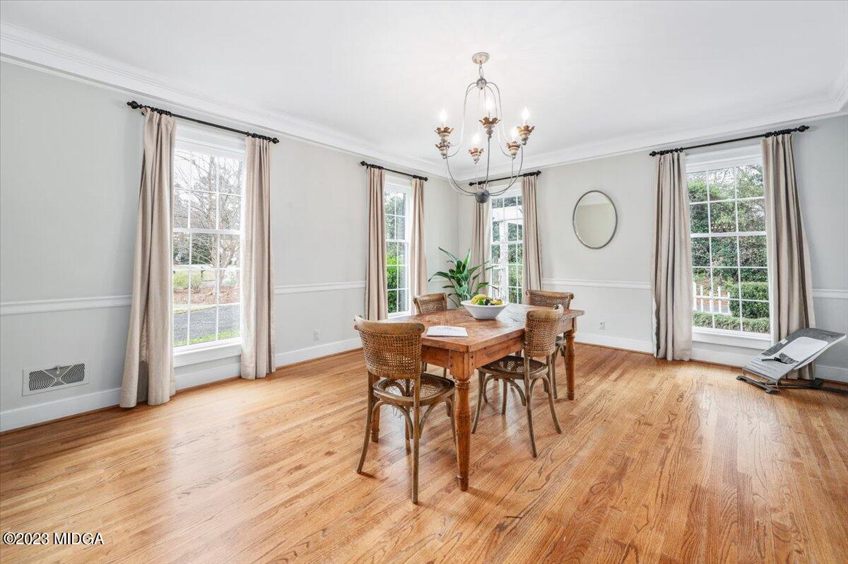 4163 Canyon Road Macon, GA 31210 - Photo 4 of 20 a view of a dining room with furniture window and wooden floor
