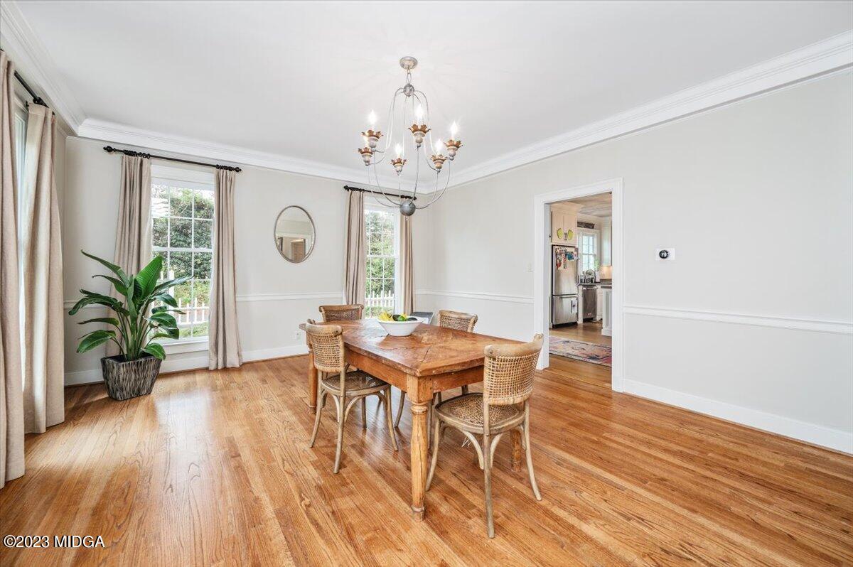 4163 Canyon Road Macon, GA 31210 - Photo 5 of 20 a view of a dining room with furniture window and wooden floor