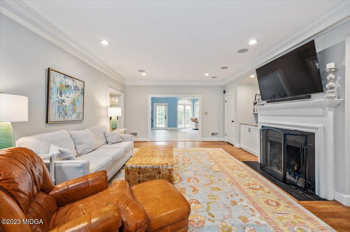 4163 Canyon Road Macon, GA 31210 - Photo 10 of 20 a living room with furniture fireplace and flat screen tv