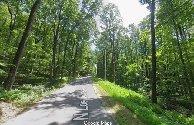 a view of a road with a yard