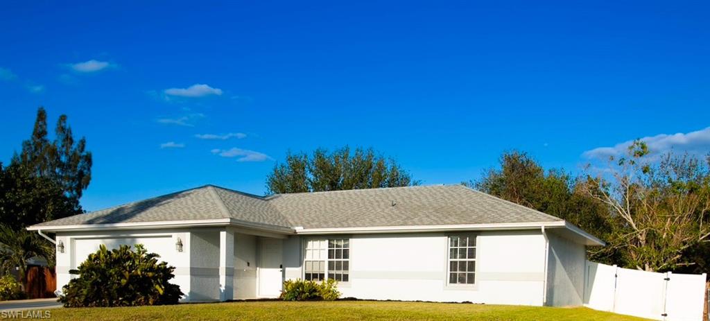 18561 Sunflower Road Fort Myers, FL 33967 - Photo 1 of 10 a front view of a house with a yard