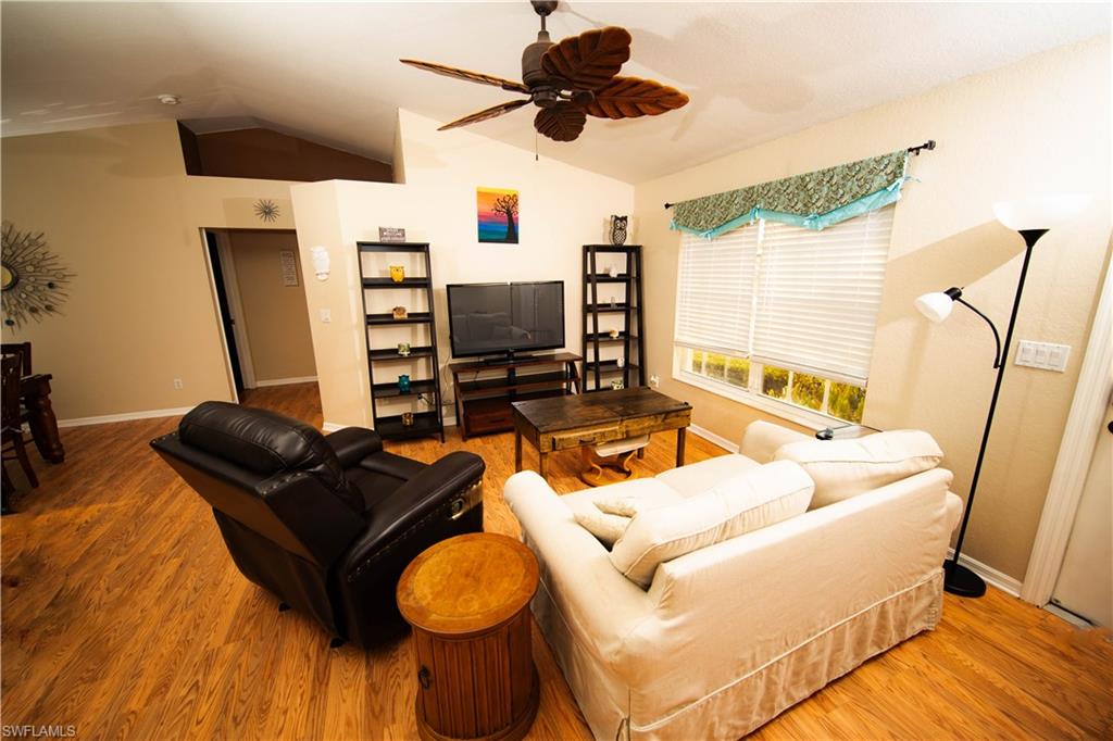 18561 Sunflower Road Fort Myers, FL 33967 - Photo 3 of 10 a living room with furniture and a flat screen tv