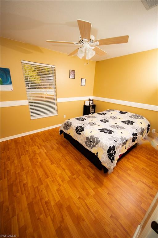18561 Sunflower Road Fort Myers, FL 33967 - Photo 9 of 10 a bedroom with a bed and a window