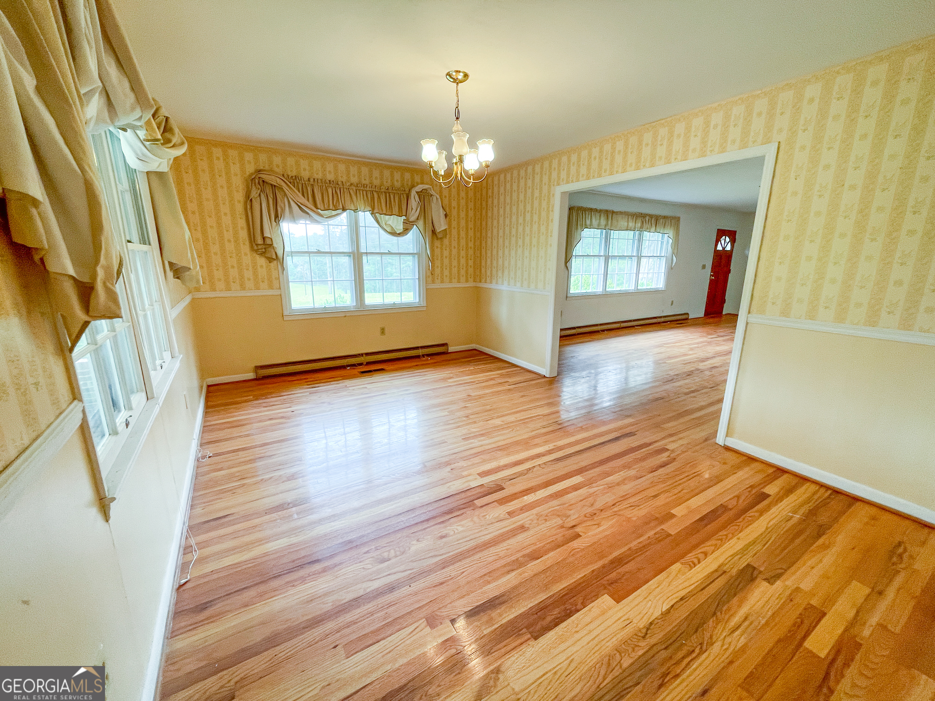 7517 Blacks Bluff Road Southwest Cave Spring, GA 30124 - Photo 18 of 57 a view of a hallway with wooden floor and stair