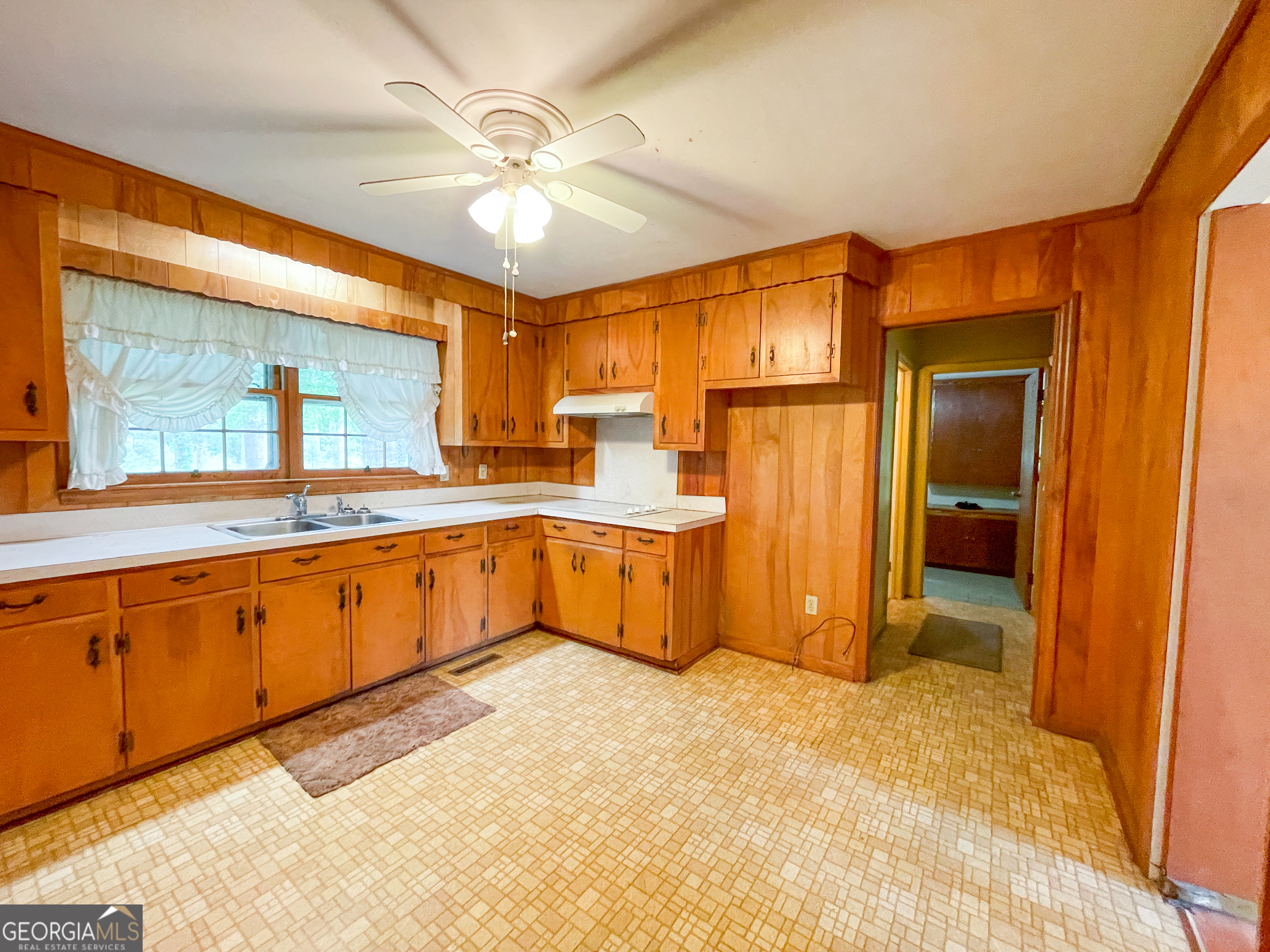 7517 Blacks Bluff Road Southwest Cave Spring, GA 30124 - Photo 21 of 57 a large kitchen with stainless steel appliances granite countertop a sink and cabinets