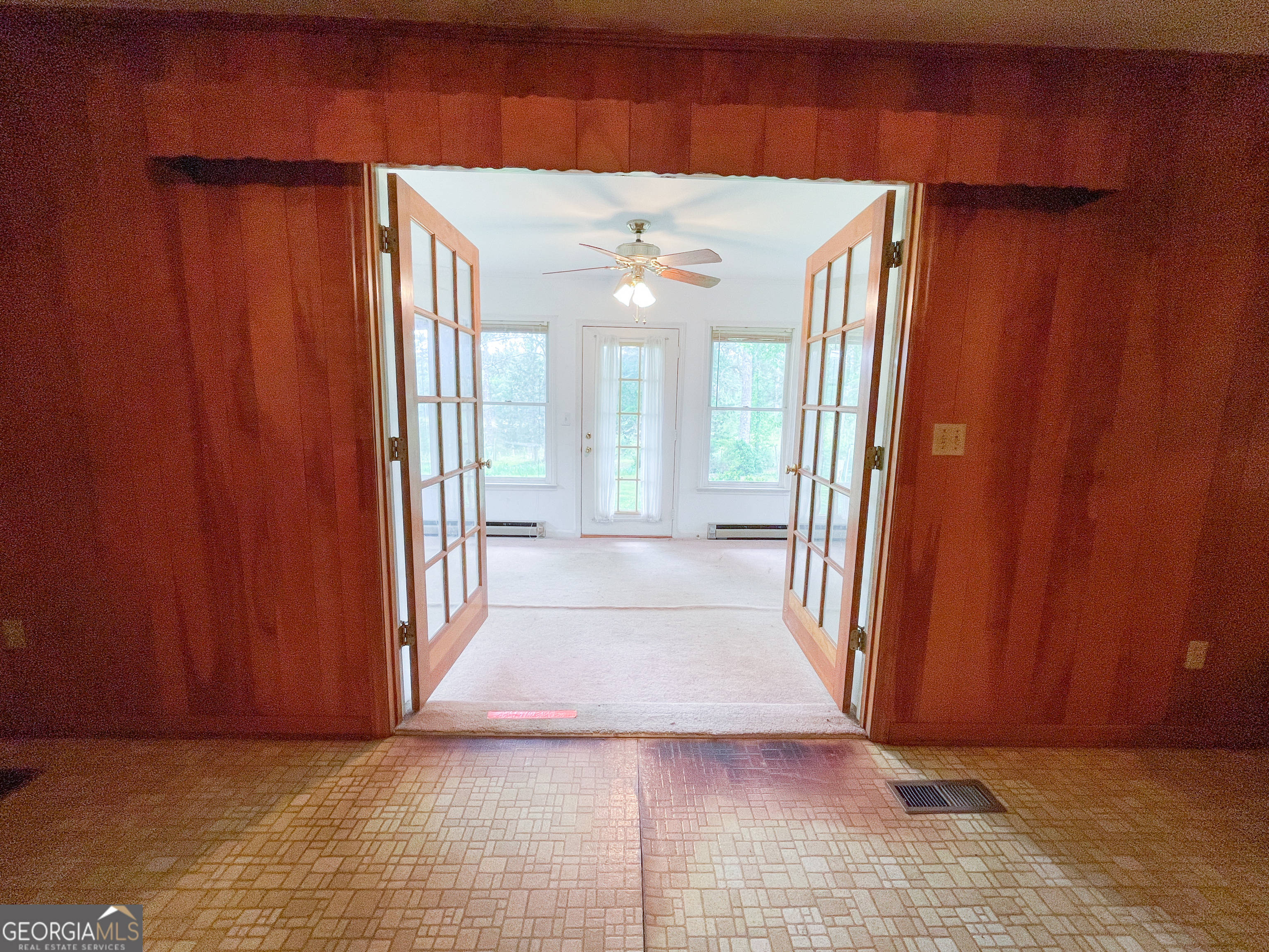 7517 Blacks Bluff Road Southwest Cave Spring, GA 30124 - Photo 28 of 57 a view of a hallway with wooden floor and staircase