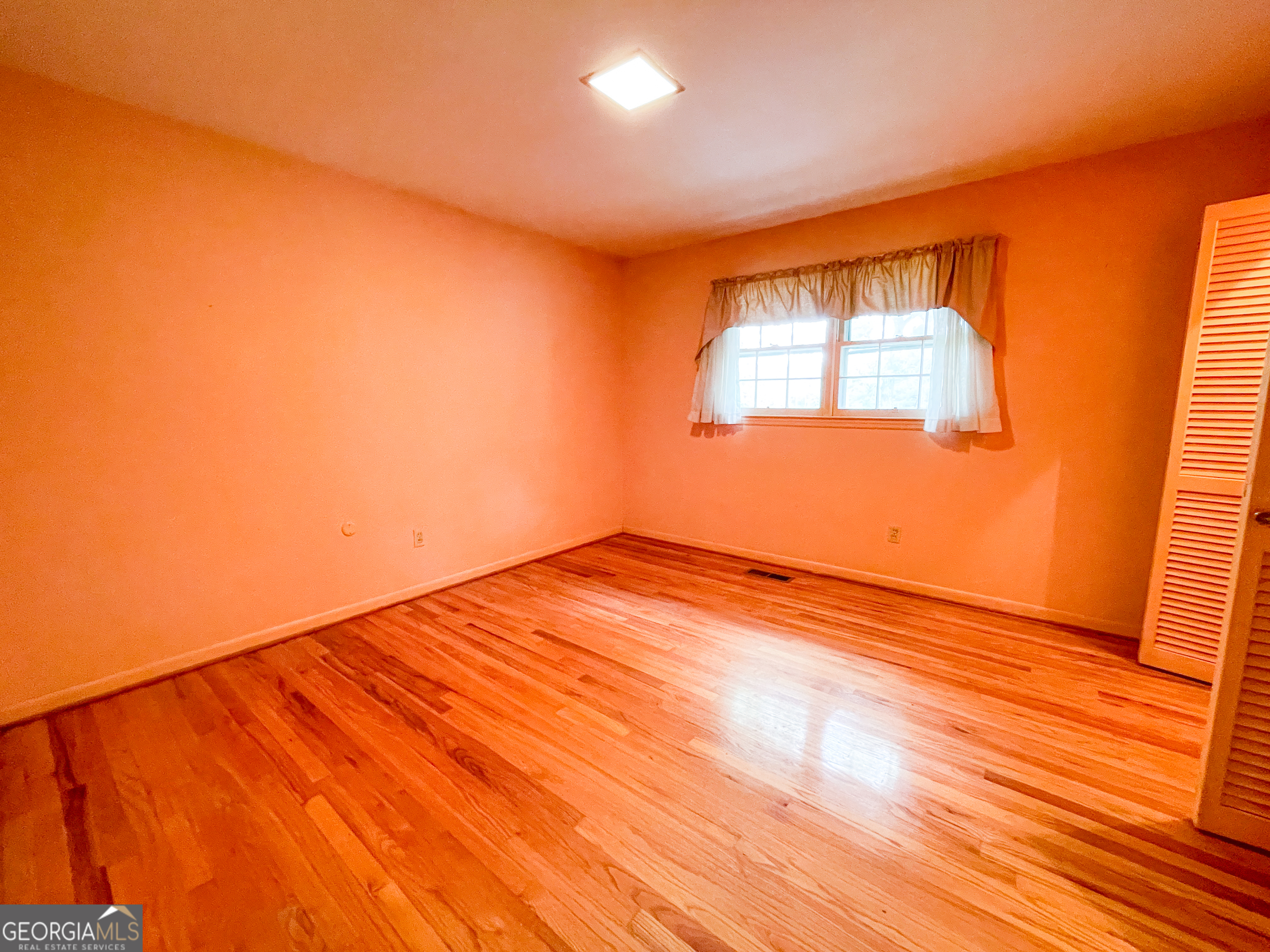 7517 Blacks Bluff Road Southwest Cave Spring, GA 30124 - Photo 35 of 57 a view of empty room with wooden floor and fan
