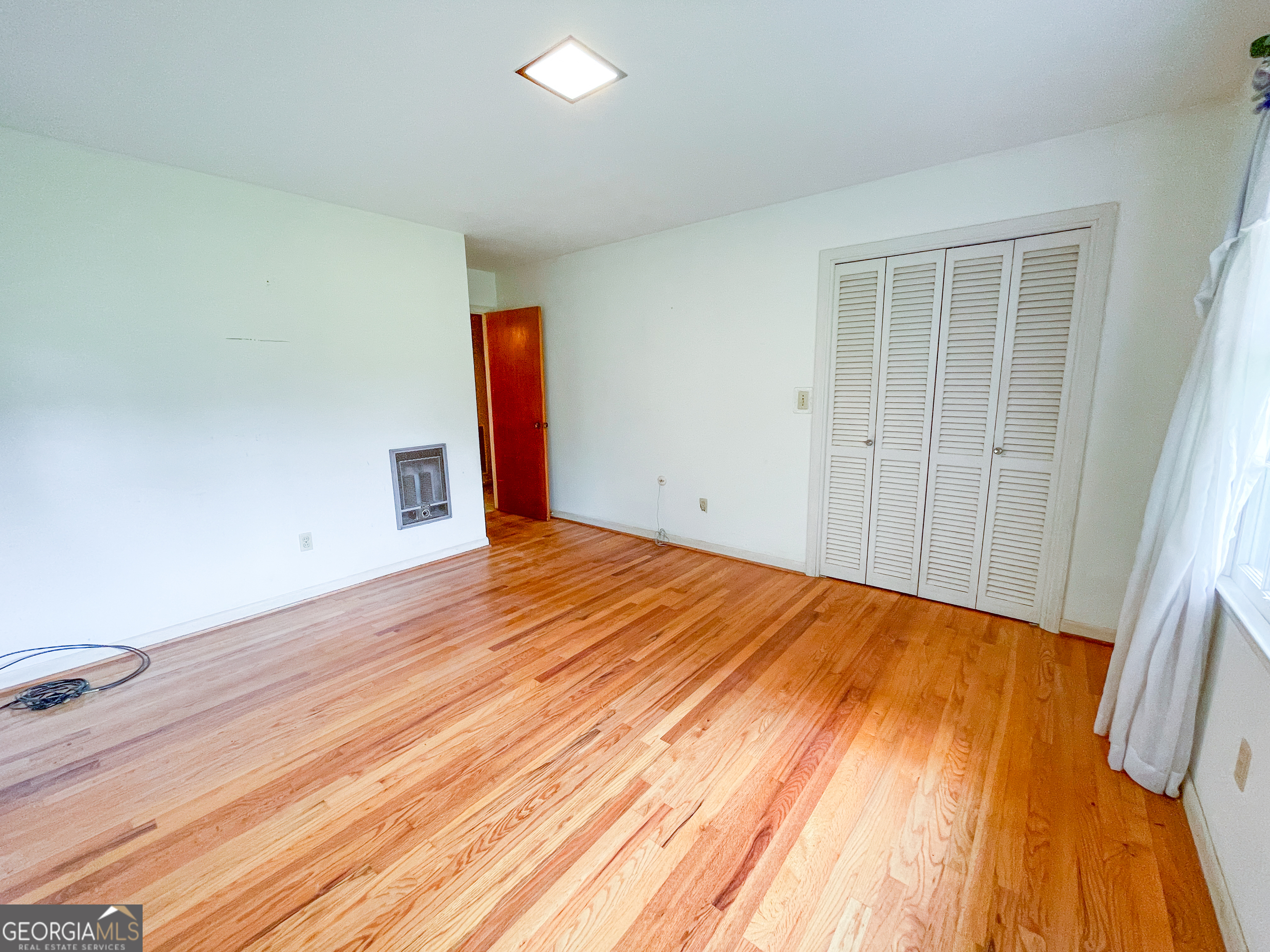 7517 Blacks Bluff Road Southwest Cave Spring, GA 30124 - Photo 39 of 57 a view of empty room with wooden floor and fan