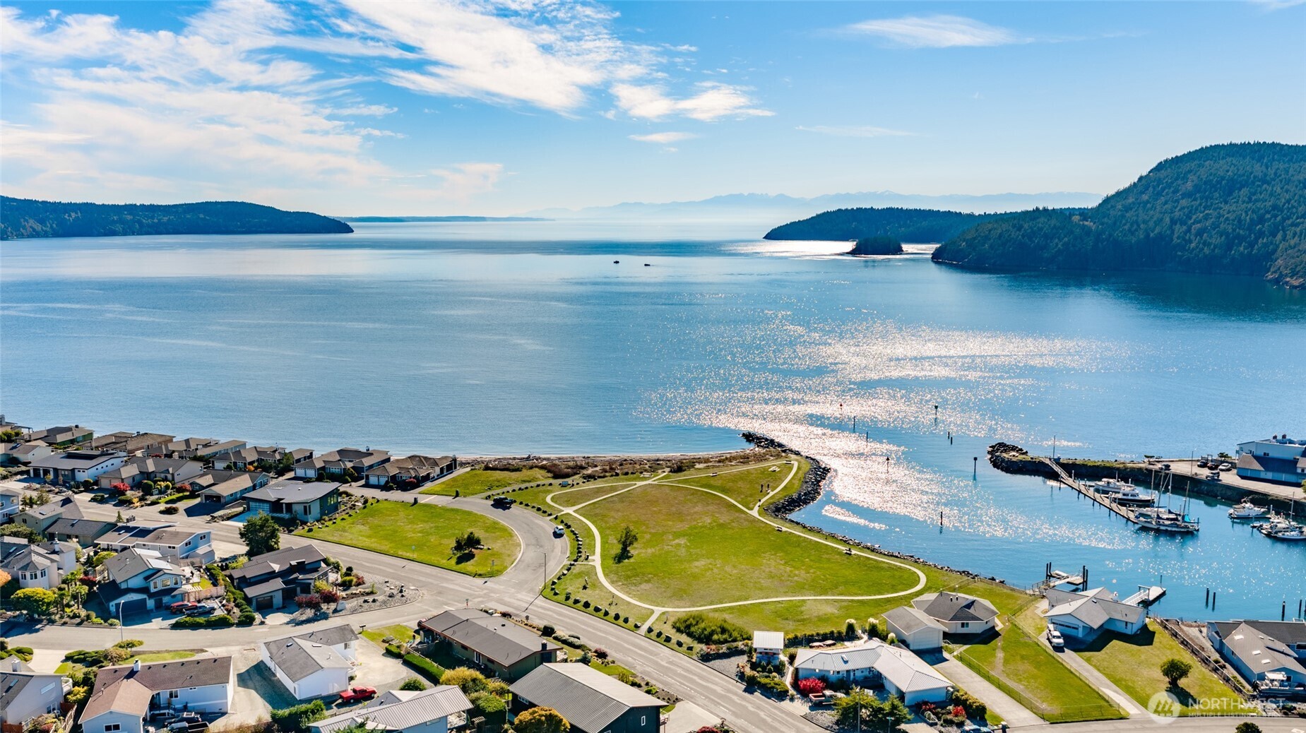 5202 Doon Way Anacortes, WA 98221 - Photo 6 of 7 an aerial view of a house with a swimming pool yard and mountain view in back