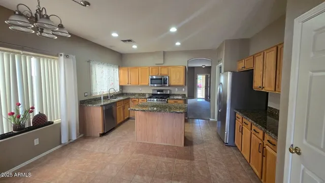 a kitchen with a refrigerator and a sink