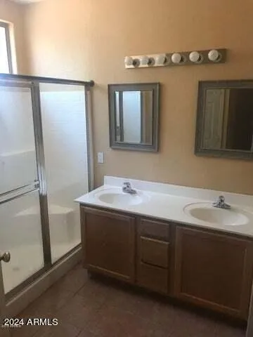 a bathroom with a sink and mirror