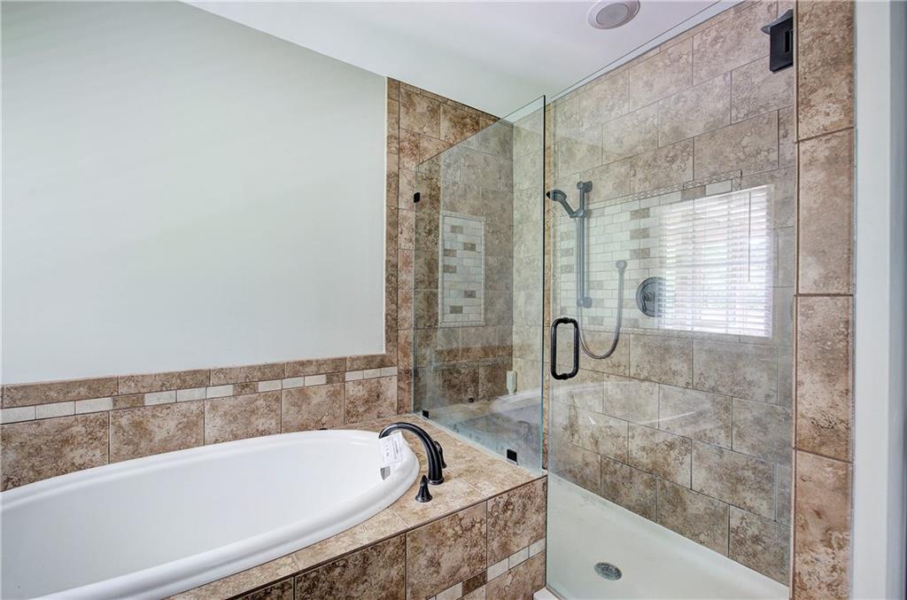 561 Holland Road Dallas, GA 30157 - Photo 27 of 48 a bath tub sitting next to a bathroom sink