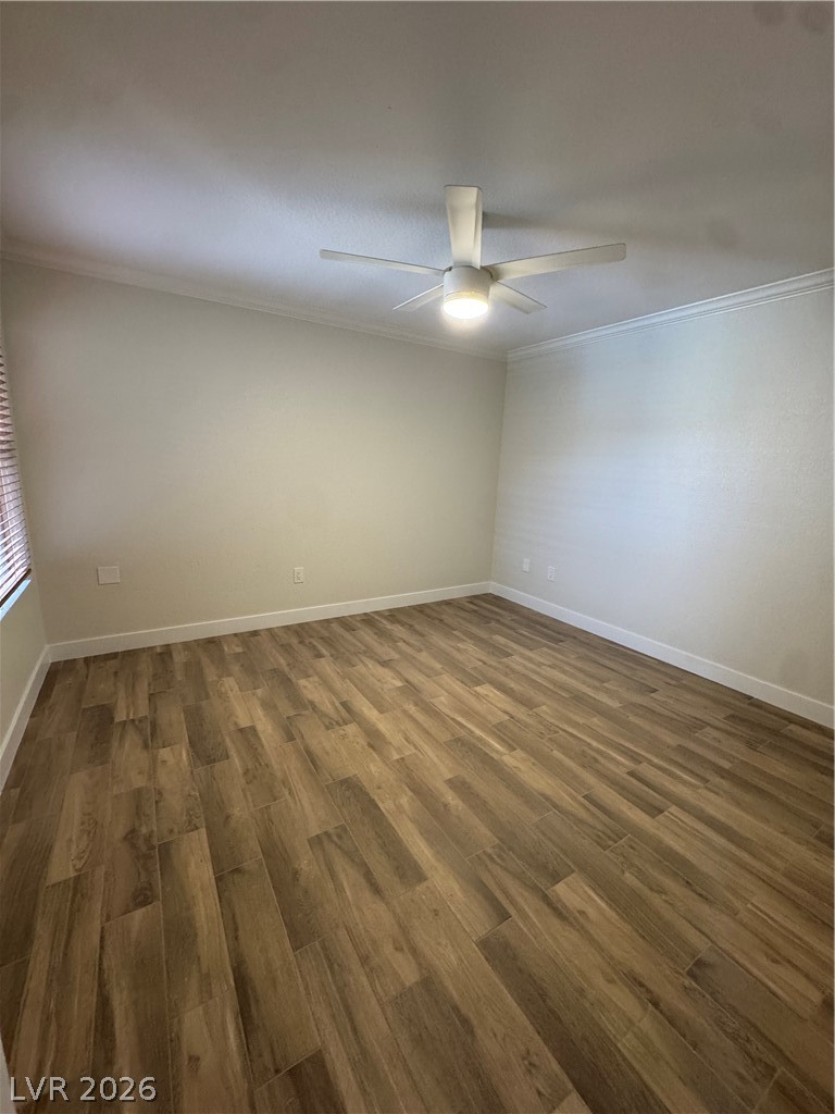 8101 West Flamingo Road, Unit 1040 Las Vegas, NV 89147 - Photo 16 of 22 This interior space features elegant wood flooring and a modern ceiling fan, creating a comfortable ambiance.
