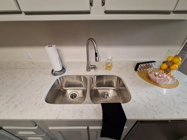 a stove top oven sitting inside of a kitchen
