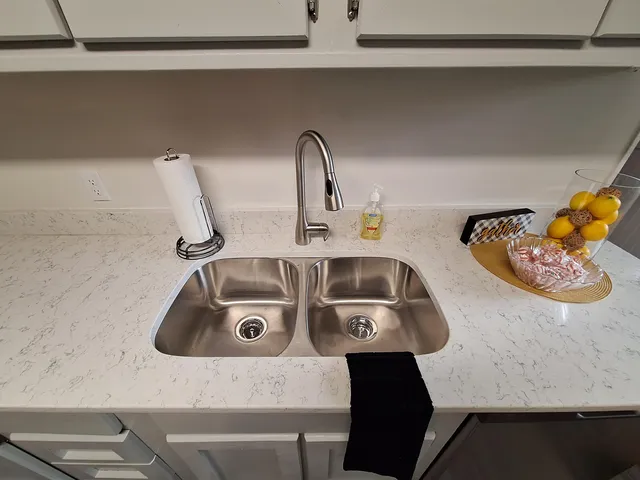 a stove top oven sitting inside of a kitchen