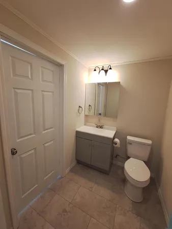 a bathroom with a glass shower door