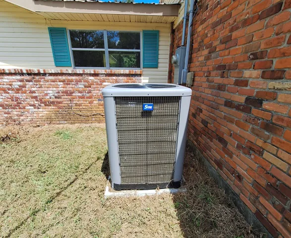 a bathroom with a toilet a sink and a mirror