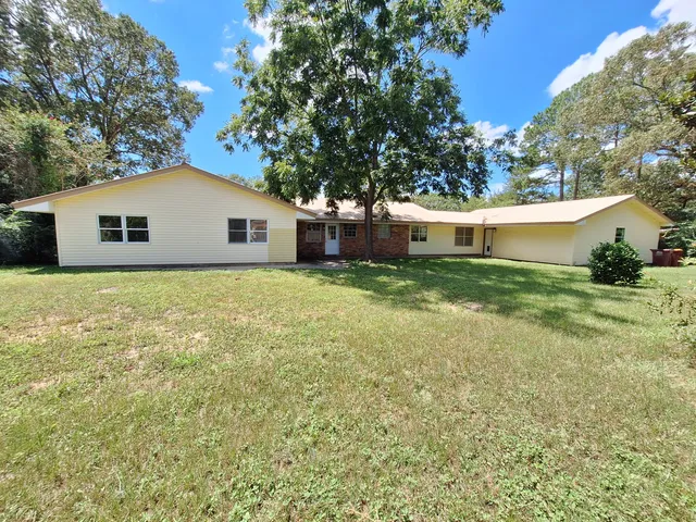a house view with a garden space