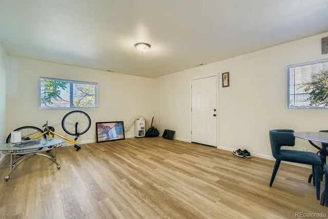 a living room with furniture and a table
