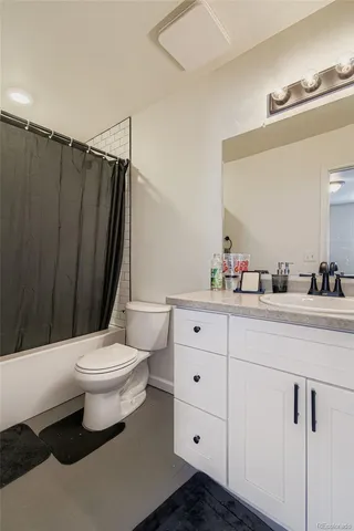 a living room with a couch and a window