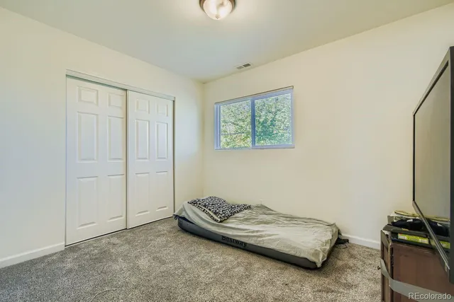 a room with a bed and a chair